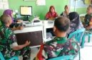 Babinsa bersama bidan desa melakukan pendataan dan pemeriksaan balita di Desa Guworejo, Karangmalang, Sragen.