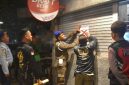 Petugas Satpol PP Kota Surabaya menyita puluhan botol minuman beralkohol dari dua restoran saat pengawasan RHU di sejumlah wilayah Kota Surabaya selama Ramadan.