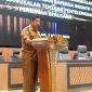 Sekda Bangkalan Ismet Efendi menyampaikan nota pendapat Bupati dalam Sidang Paripurna DPRD terkait Raperda Penyelenggaraan Perizinan Berusaha di Daerah, Senin (2/3/2026).